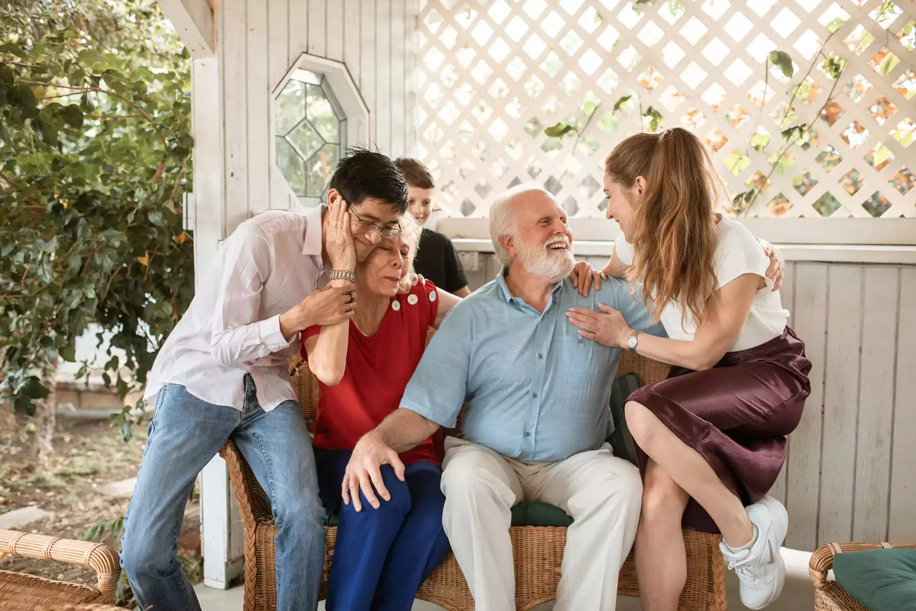 Multi-generation family sharing a warm moment outdoors