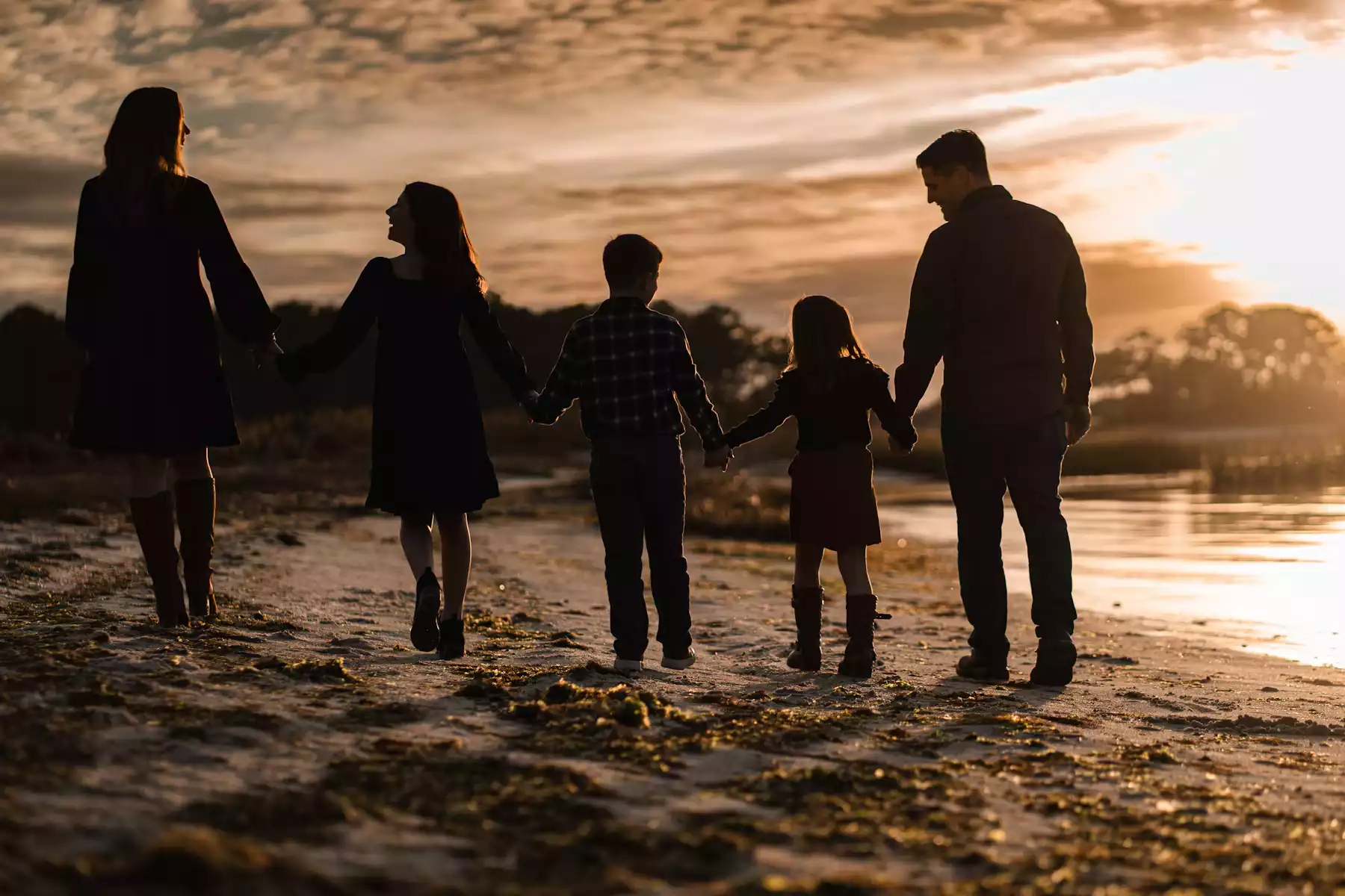 Family walking by the sea, symbolizing cross-generation legacy